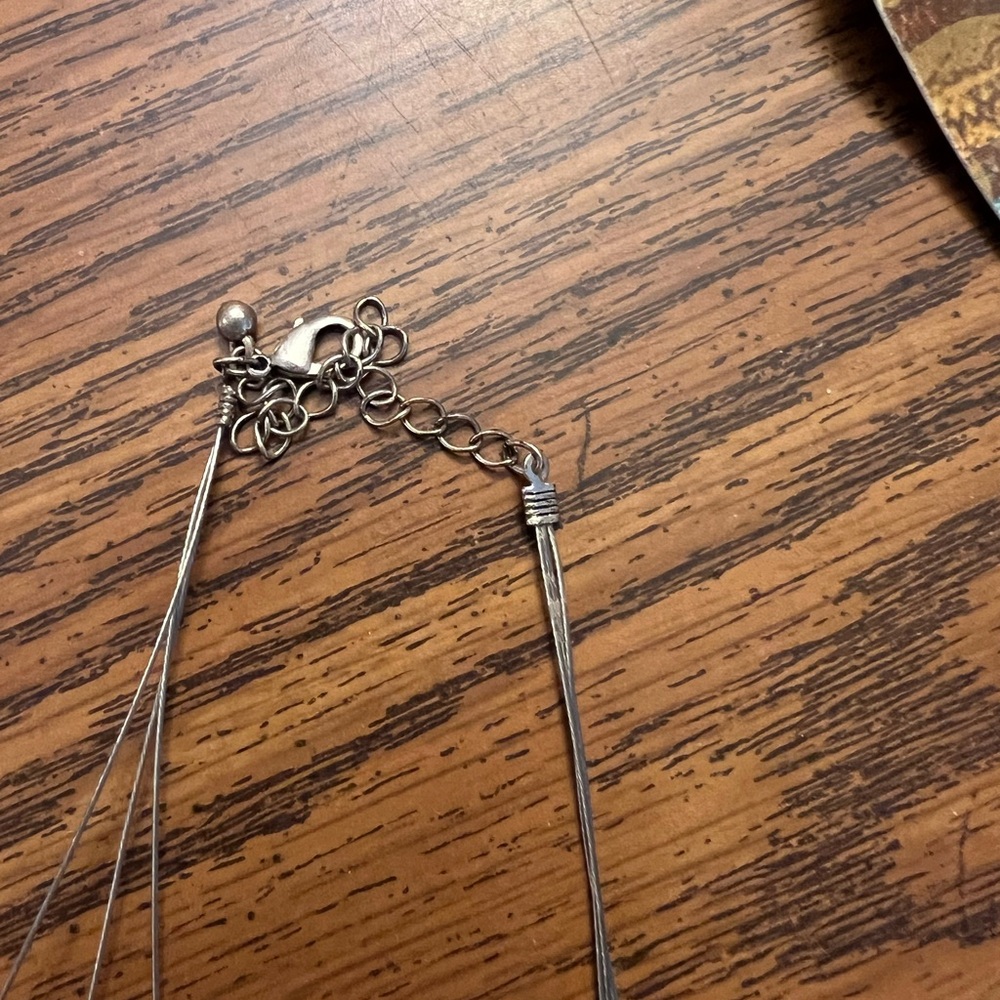 Silver Necklace with Textured Pendants and Leaf Accents - Picture 3 of 4